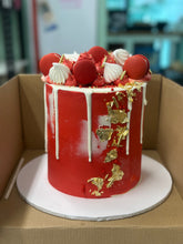 Load image into Gallery viewer, Macaron and Meringue Loaded Cake with Gold Leaf detail
