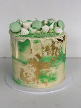 Load image into Gallery viewer, Macaron and Meringue Loaded Cake with Gold Leaf detail
