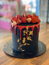 Load image into Gallery viewer, Macaron and Meringue Loaded Cake with Gold Leaf detail
